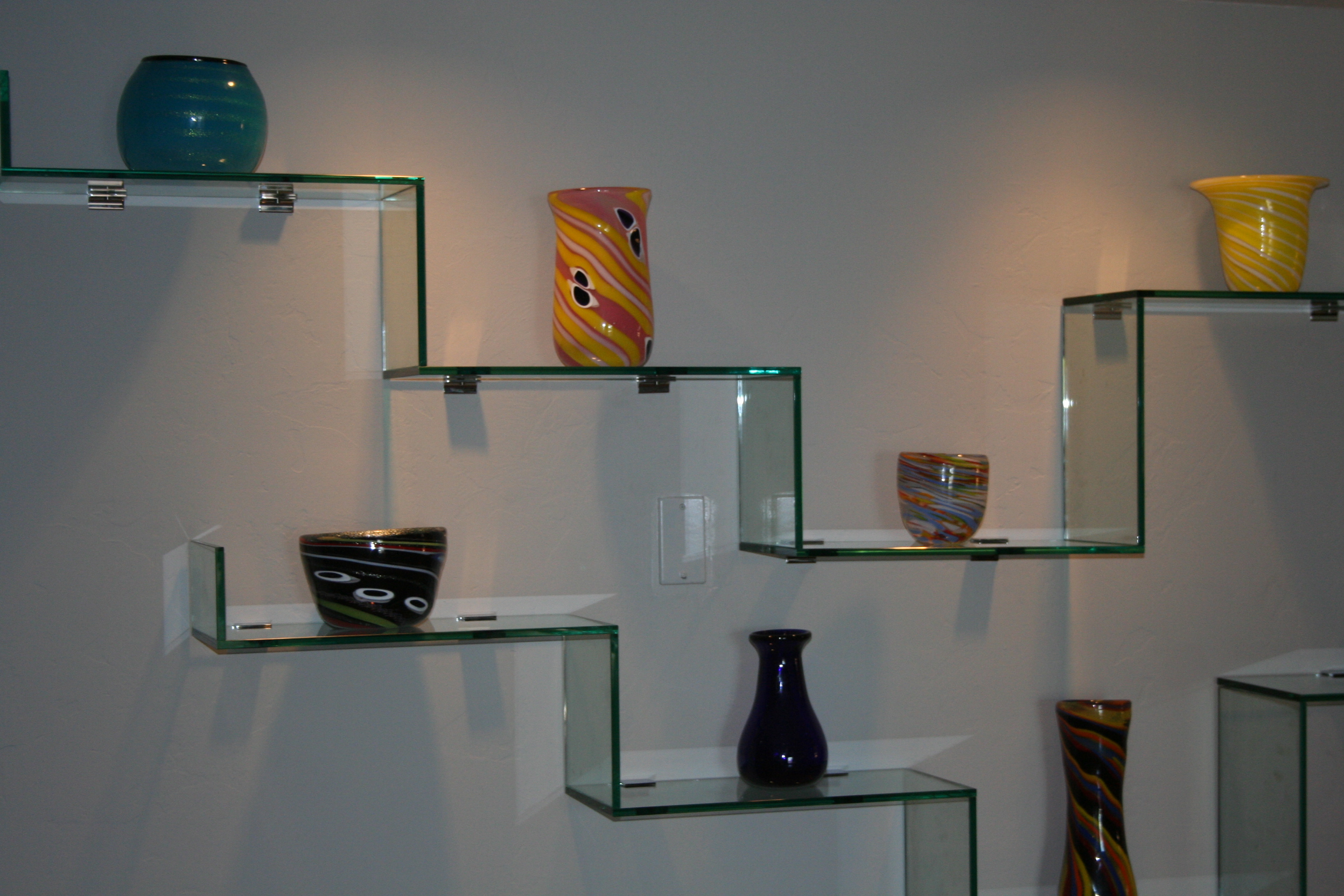 Artistry in Glass designs contemporary glass shelves, attached to wall 